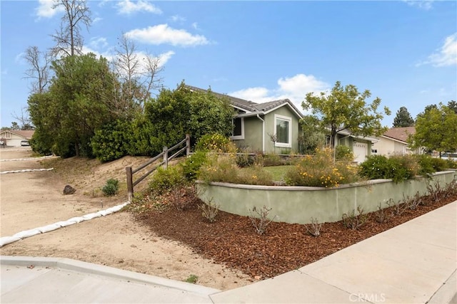 view of property hidden behind natural elements