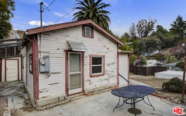 back of house with a patio area