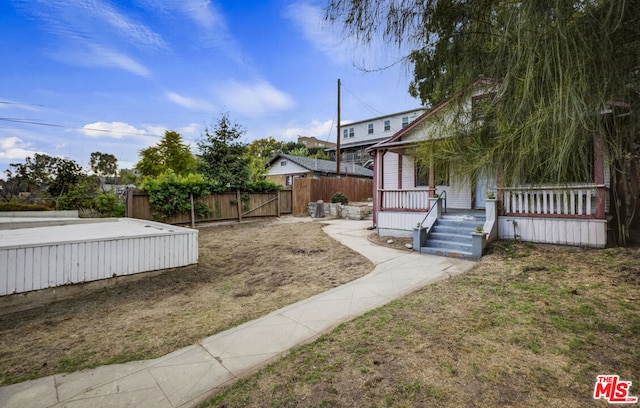 view of yard with a wooden deck