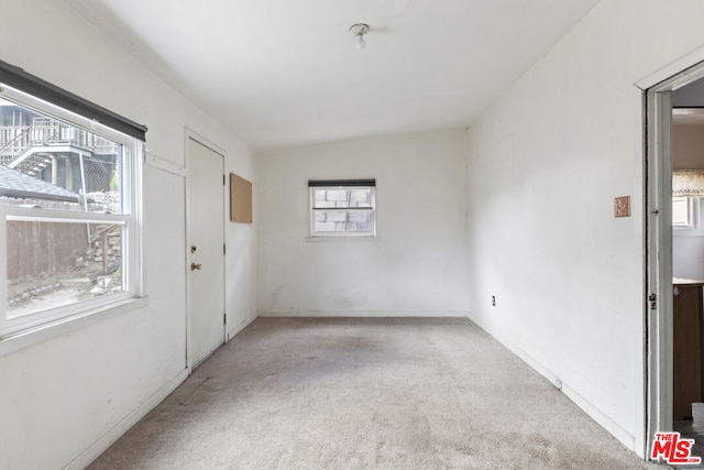 unfurnished room featuring carpet