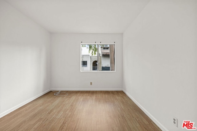 spare room featuring light hardwood / wood-style flooring