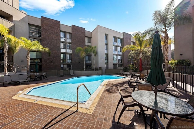 view of swimming pool featuring a patio