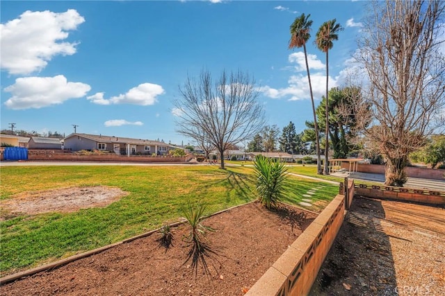 view of home's community with a yard