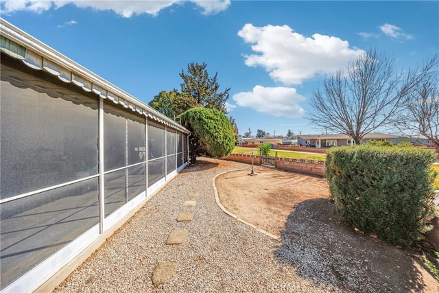 view of yard featuring a sunroom