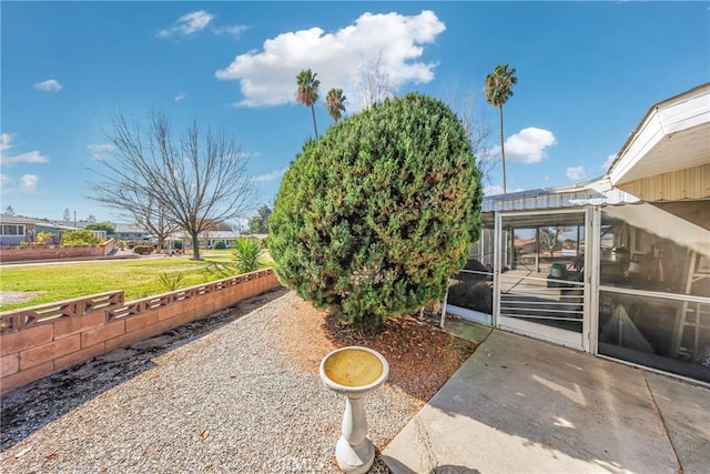 view of yard with a sunroom