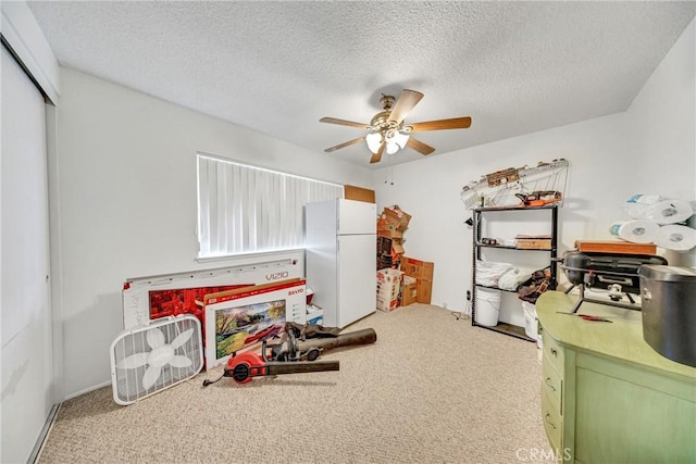 34473 Arbor Way, Yucaipa, CA 92399 - carpeted bedroom featuring freestanding refrigerator, a closet, ceiling fan, and a textured ceiling