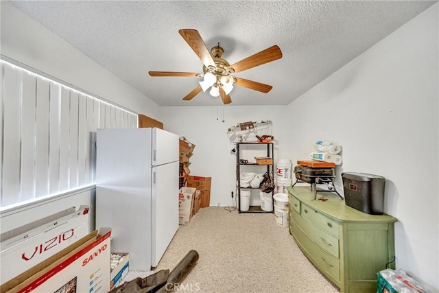 34473 Arbor Way, Yucaipa, CA 92399 - kitchen with freestanding refrigerator, green cabinetry, a ceiling fan, carpet, and a textured ceiling