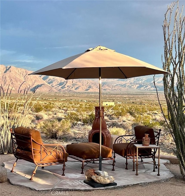 view of patio / terrace featuring a mountain view