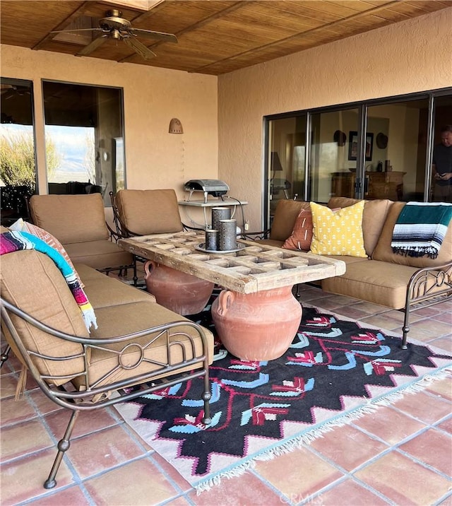 view of patio featuring ceiling fan