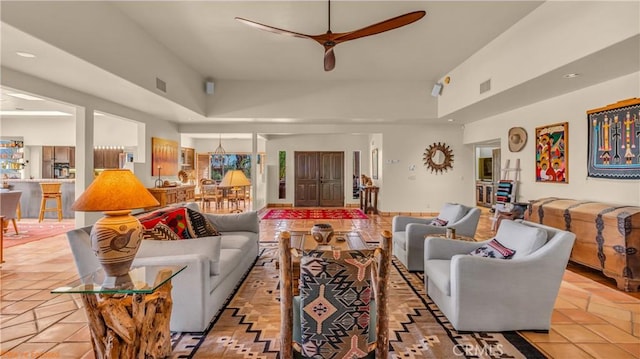 living area with visible vents, light tile patterned flooring, a ceiling fan, and recessed lighting