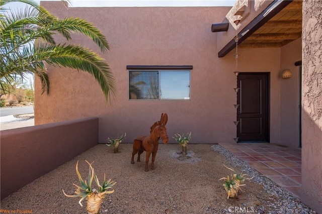 exterior space with stucco siding