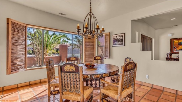 dining room featuring an inviting chandelier and visible vents