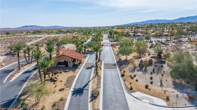 birds eye view of property with a mountain view