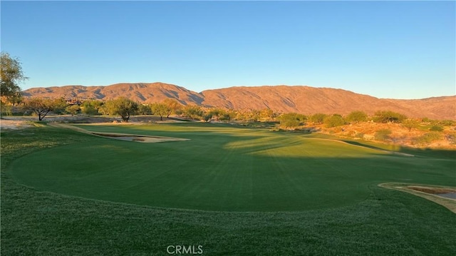 view of property's community with a mountain view and golf course view