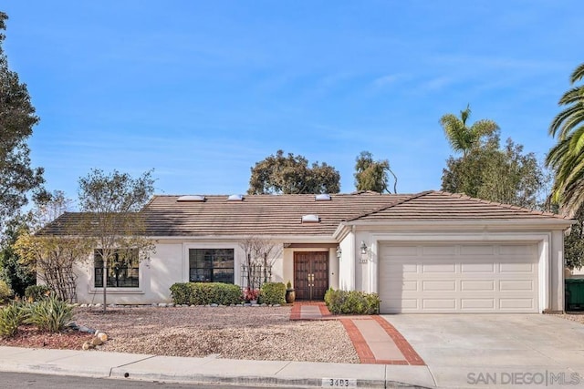 single story home with a garage