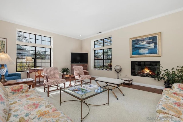 living room with ornamental molding and wood-type flooring