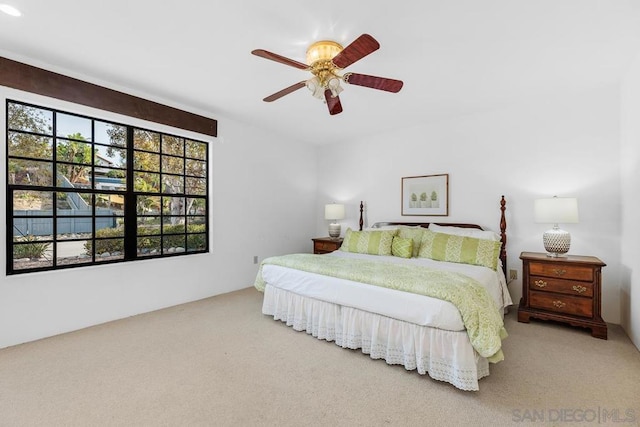 bedroom with ceiling fan and carpet