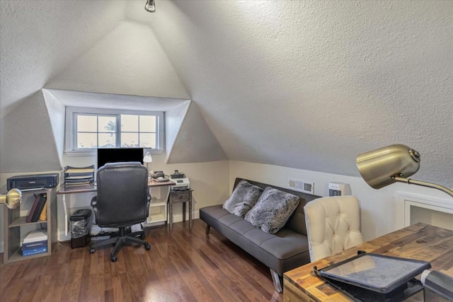 office area featuring dark hardwood / wood-style floors, vaulted ceiling, and a textured ceiling