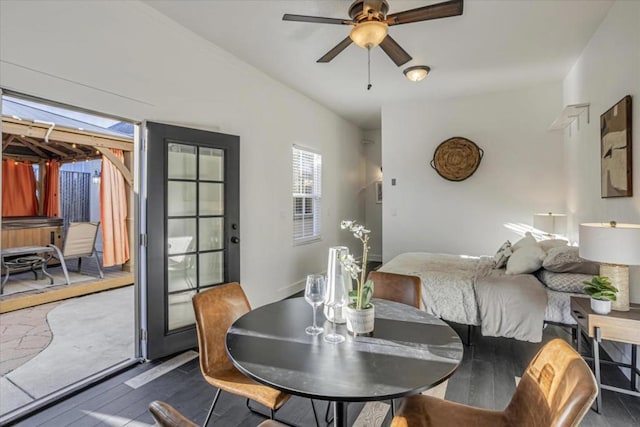 dining room with dark wood-type flooring and ceiling fan