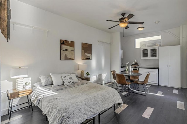 bedroom featuring dark hardwood / wood-style floors and ceiling fan