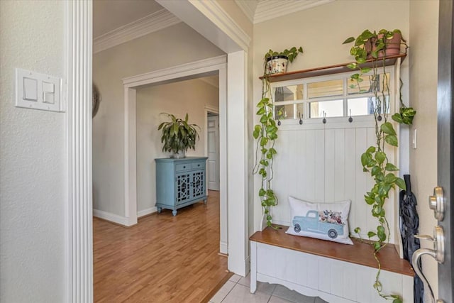 mudroom with light hardwood / wood-style flooring and ornamental molding