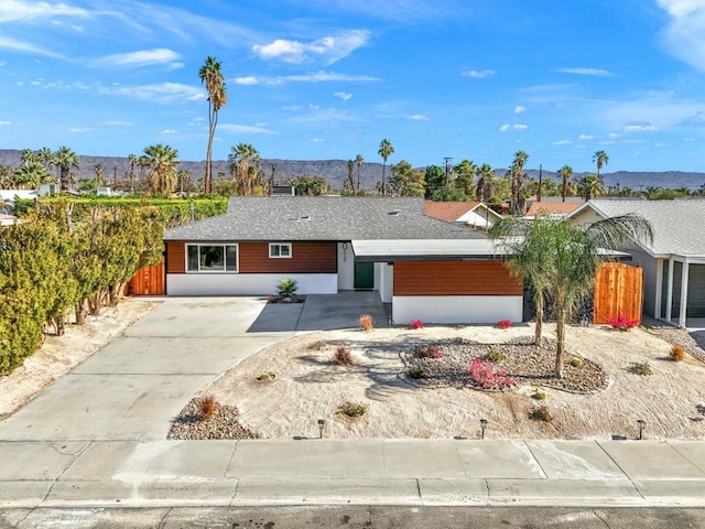 single story home featuring a mountain view