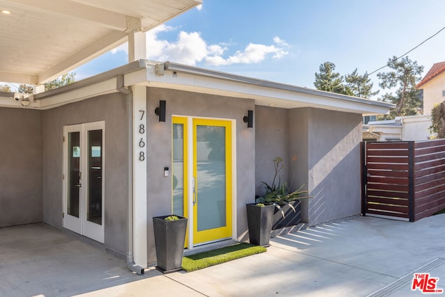 doorway to property featuring a patio