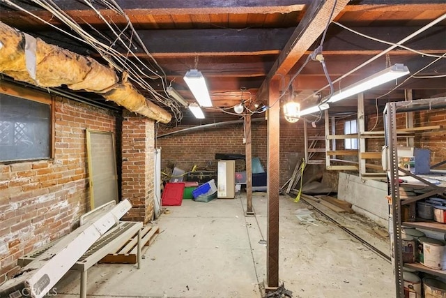 basement with brick wall