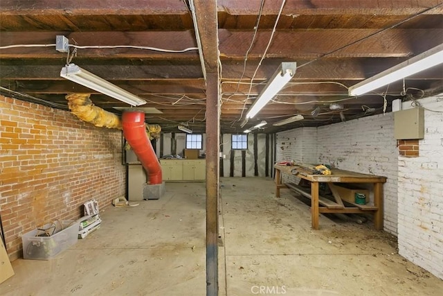 basement with brick wall