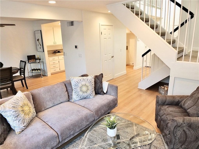 living room with light hardwood / wood-style floors