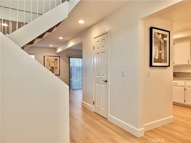 hall with light hardwood / wood-style floors