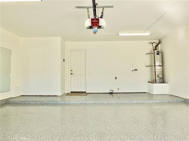 garage with a garage door opener and water heater