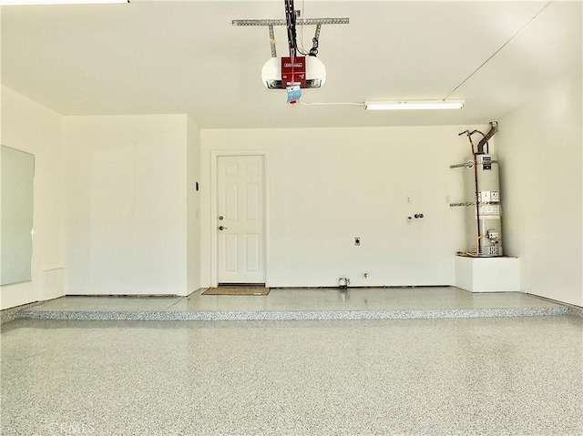 garage featuring a garage door opener and water heater