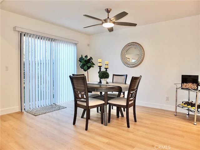 dining area featuring ceiling fan and light hardwood / wood-style flooring