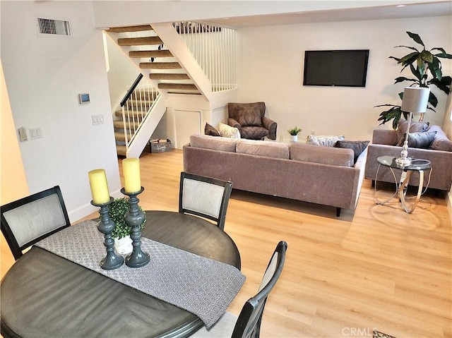 dining area with hardwood / wood-style flooring