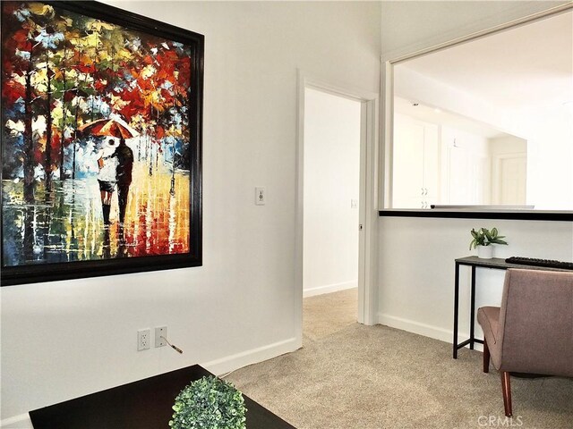 interior space featuring light colored carpet