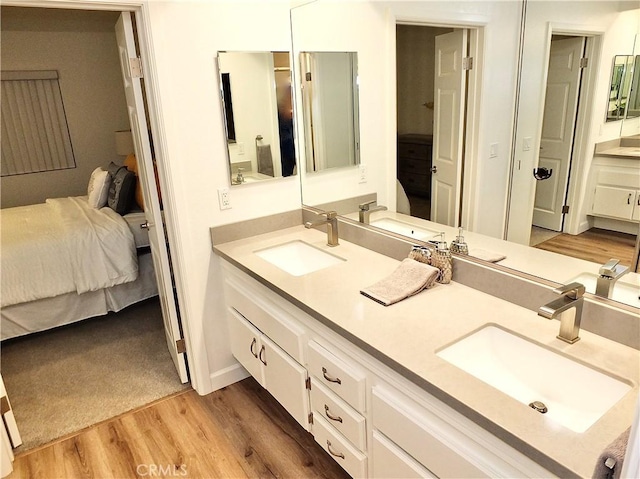 bathroom featuring vanity and hardwood / wood-style floors