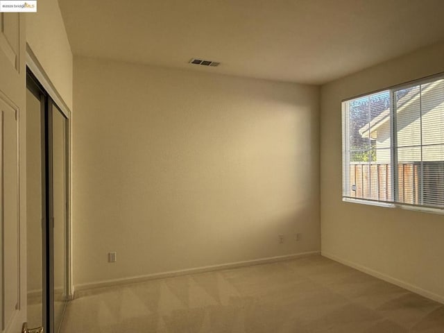 view of carpeted spare room