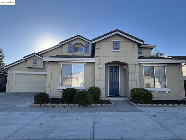 front of property with a garage