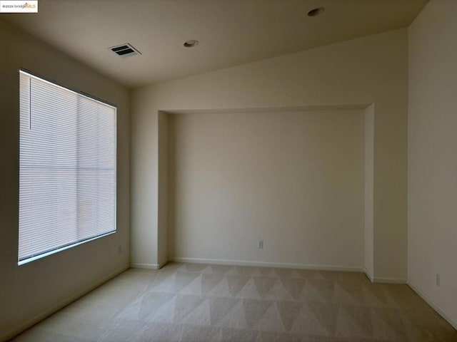 unfurnished room with light colored carpet