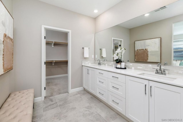 bathroom with vanity and backsplash