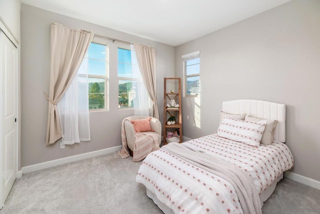 carpeted bedroom featuring a closet