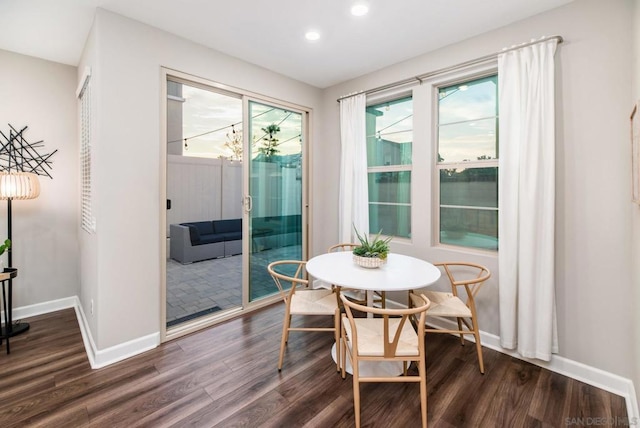 dining room with dark hardwood / wood-style floors