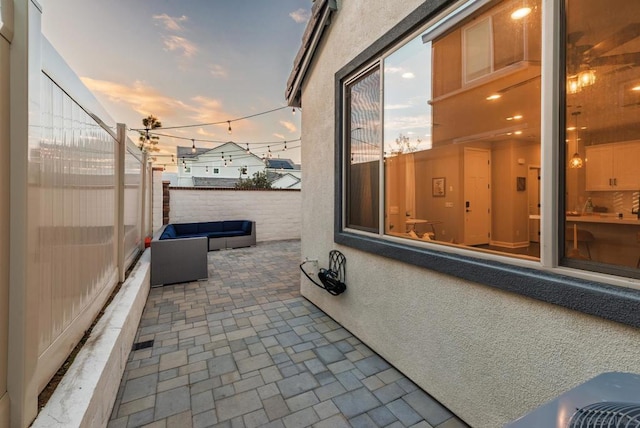 view of patio terrace at dusk