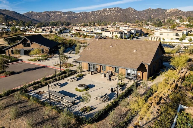 birds eye view of property featuring a mountain view