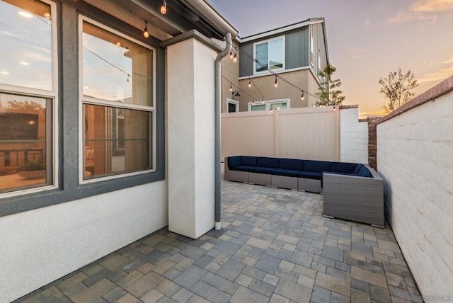 patio terrace at dusk with an outdoor hangout area