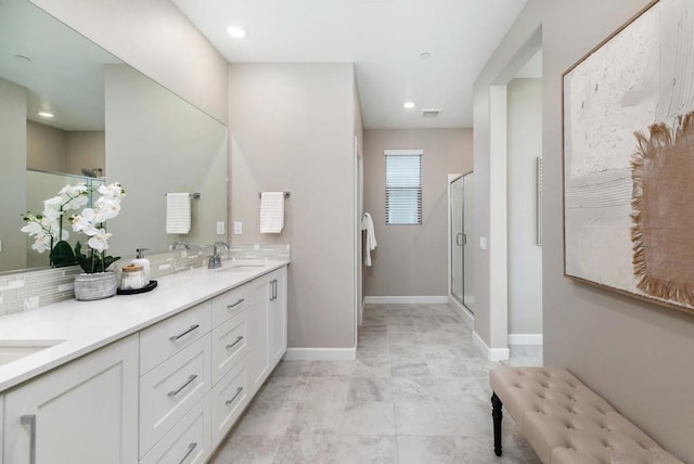 bathroom with vanity and an enclosed shower