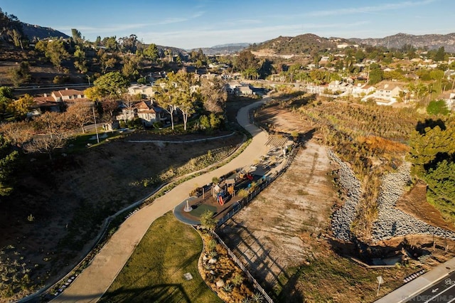 birds eye view of property featuring a mountain view