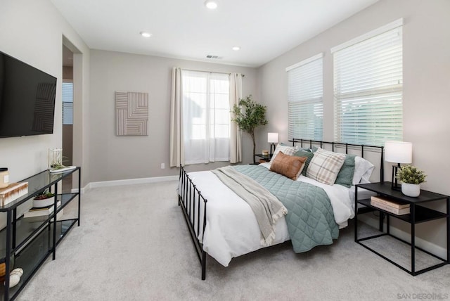 bedroom with light colored carpet