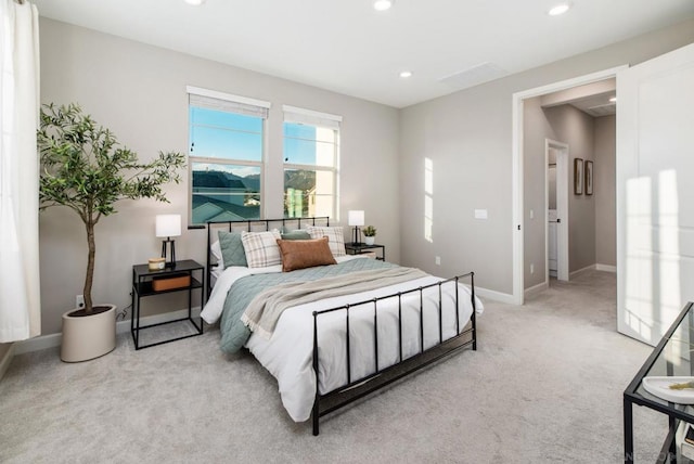 bedroom featuring light carpet